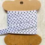 Lint Wit met zwarte stip