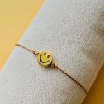 Armbandje smile goudkleurig