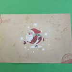 Envelop kerst schaatsende kerstman