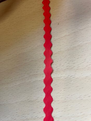 Krullint rood golvend