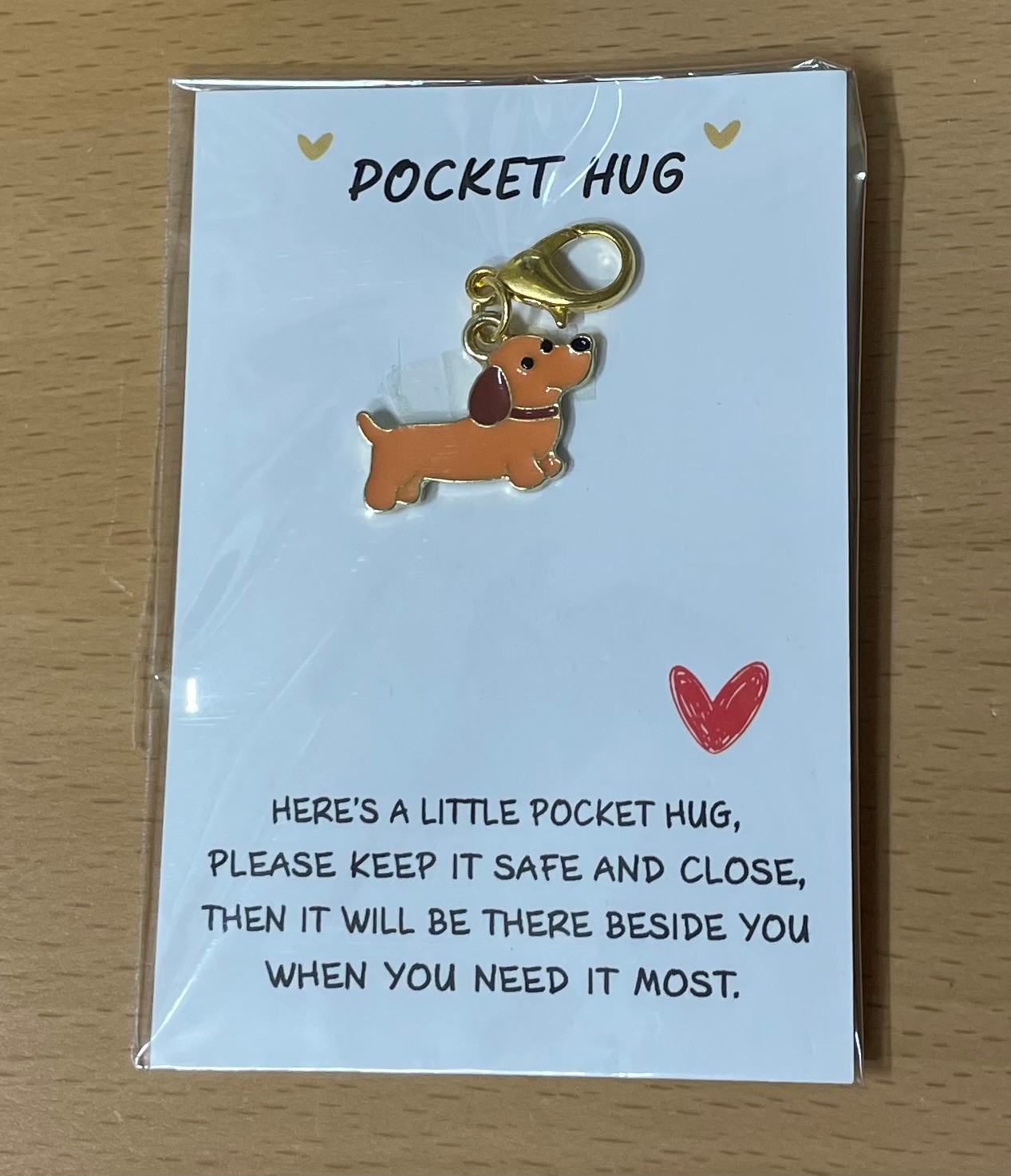 teckel hanger Pocket Hug Teckel Hanger - Image 1